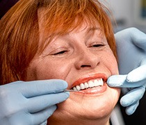 Older woman receiving dental exam